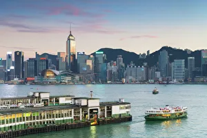 View of Star Ferry Terminal and Hong Kong Island skyline at dusk, Hong Kong, China, Asia View of Star Ferry Terminal and Hong Kong Island skyline at dusk, Hong Kong, China, Asia