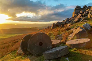 View of sunset and old millstones at Curbar Edge during autumn, Derbyshire, Peak View of sunset and old millstones at Curbar Edge during autumn, Derbyshire, Peak