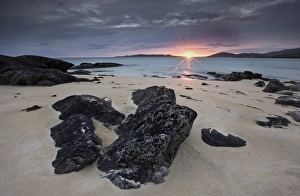 View towards Taransay at sunset from the rocky shore at Scarista, Isle of Harris View towards Taransay at sunset from the rocky shore at Scarista, Isle of Harris