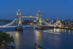 View of Tower Bridge and River Thames from Cheval Three Quays at dusk, London, England View of Tower Bridge and River Thames from Cheval Three Quays at dusk, London, England