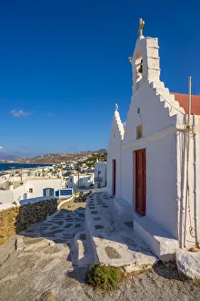 Greek Island Hopping Guide Prints: View of whitewashed chapel overlooking town, Mykonos Town, Mykonos, Cyclades Islands