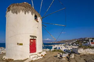 European Vacation Spots Prints: View of whitewashed windmill overlooking town, Mykonos Town, Mykonos, Cyclades Islands