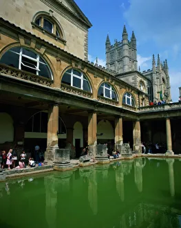 Visitors in the Roman Baths, with the Abbey beyond in Bath, UNESCO World Heritage Site Visitors in the Roman Baths, with the Abbey beyond in Bath, UNESCO World Heritage Site