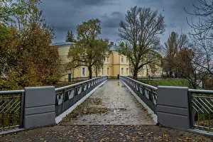 Prints of Visitors walk on a bridge toward a historic building in a park on a cloudy day in Gomel, Belarus Belarus Prints: Gomel Park Bridge Print