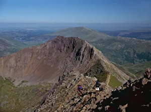Walkers approaching the summit of Mount Snowdon from the ridge of Y Lliwedd Walkers approaching the summit of Mount Snowdon from the ridge of Y Lliwedd