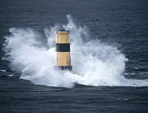 Images Dated 10th February 2021: Waves crash on Tourelle de la Plate Lighthouse, Pointe du Raz, Finistere, Brittany