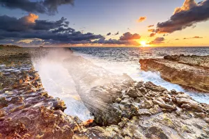 Antigua And Barbuda Tourism Prints: Waves crashing on cliffs at sunrise, Devils Bridge, Antigua, Antigua and Barbuda