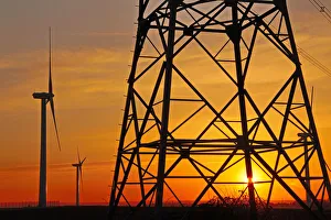 Windmills, pylon and power lines in morning light, Germany, Europe Windmills, pylon and power lines in morning light, Germany, Europe