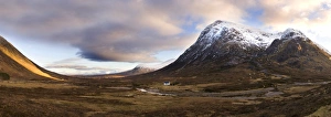 Winter panoramic view of Rannoch Moor showing lone whitewashed cottage on the bank of a river Winter panoramic view of Rannoch Moor showing lone whitewashed cottage on the bank of a river