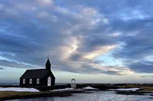 Winter view at dusk of black wooden church at Budir, Snaefellsnes Peninsula, Iceland Winter view at dusk of black wooden church at Budir, Snaefellsnes Peninsula, Iceland