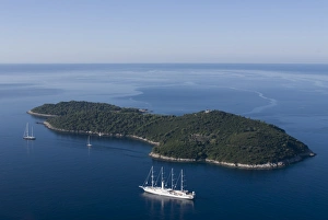 Yacht sailing round the island of Lokrum, part of the Elaphite Islands Yacht sailing round the island of Lokrum, part of the Elaphite Islands