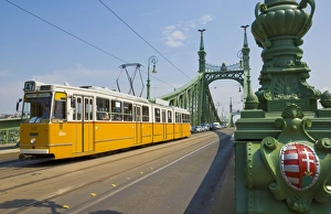 Yellow tram on The Liberty Bridge (Szabadsag hid), over the Rver Danube Yellow tram on The Liberty Bridge (Szabadsag hid), over the Rver Danube