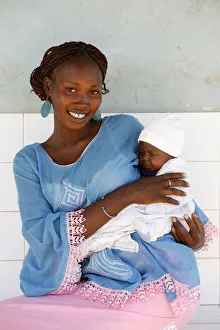 Young woman carrying her baby, Garage-Bentenier, Thies, Senegal, West Africa, Africa Young woman carrying her baby, Garage-Bentenier, Thies, Senegal, West Africa, Africa