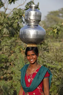 Young woman fetching water, Mathura, Uttar Pradesh, India, Asia Young woman fetching water, Mathura, Uttar Pradesh, India, Asia