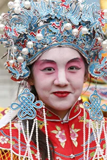 Young woman wearing traditional costumes, Chinese New Year, Paris, France, Europe Young woman wearing traditional costumes, Chinese New Year, Paris, France, Europe