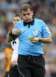 Images Dated 11th September 2010: Wolverhampton Wanderers Yellow Card Onslaught: Refee Phil Dowd Issues Yet Another Yellow in Fulham