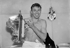 Aston Villa captain Johnny Dixon with the FA Cup in 1957 Aston Villa captain Johnny Dixon with the FA Cup in 1957