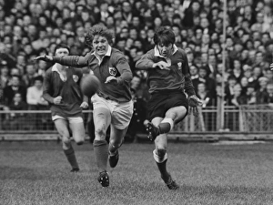Barry John kicks under pressure from Fergus Slattery - 1971 Five Nations Barry John kicks under pressure from Fergus Slattery - 1971 Five Nations