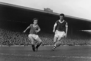 Bobby Charlton crosses the ball against Arsenal in 1958 Bobby Charlton crosses the ball against Arsenal in 1958