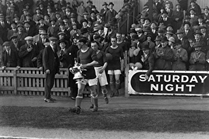 Cardiff City captain Fred Keenor leads his side onto the field with the FA Cup in 1927 Cardiff City captain Fred Keenor leads his side onto the field with the FA Cup in 1927