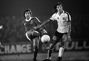 Ipswich Town Collection: George Best passes the ball as he is challenged by Glenn Hoddle