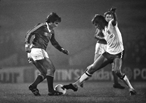 Glenn Hoddle attempts to tackle George Best Glenn Hoddle attempts to tackle George Best