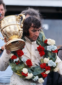 Jackie Stewart with the trophy after winning the 1969 British Grand Prix Jackie Stewart with the trophy after winning the 1969 British Grand Prix