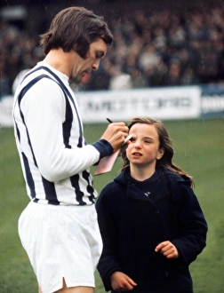 Jeff Astle signs an autograph for a young West Bromwich Albion fan Jeff Astle signs an autograph for a young West Bromwich Albion fan