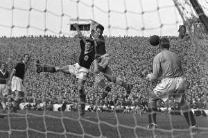 John Charles rises to win a header during the 1957 Home Championship John Charles rises to win a header during the 1957 Home Championship