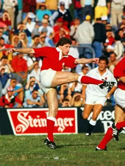 Images Dated 8th June 1987: Jonathan Davies kicks ahead for Wales - 1987 Rugby World Cup