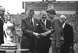 League President Len Shipman presents the Championship trophy to Manchester United co-captain Denis Law in 1967 League President Len Shipman presents the Championship trophy to Manchester United co-captain Denis Law in 1967