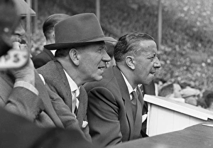 Manchester United manager Matt Busby sits on the bench with caretaker manager Jimmy Manchester United manager Matt Busby sits on the bench with caretaker manager Jimmy