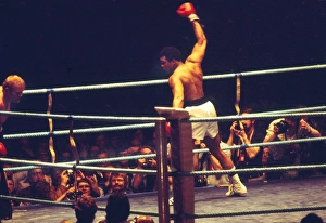 Muhammad Ali show off to the crowd as he knocks down Richard Dunn Muhammad Ali show off to the crowd as he knocks down Richard Dunn