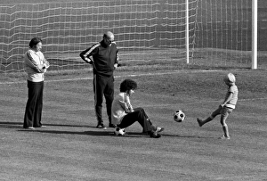 Paul Breitner sits on a ball with Helmut Schoen after West Germany training - 1974 World Paul Breitner sits on a ball with Helmut Schoen after West Germany training - 1974 World