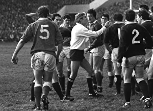Referee Roger Quittenton steps-in to stop the Scottish and Welsh forwards fighting - 1983 Five Nations Referee Roger Quittenton steps-in to stop the Scottish and Welsh forwards fighting - 1983 Five Nations