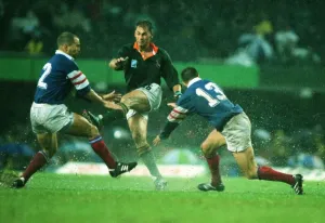 Rugby World Cup Prints: Andre Joubert Kicks Ahead in Rain Print