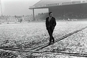 Spurs captain Dave Mackay inspects a snowy Maine Road Spurs captain Dave Mackay inspects a snowy Maine Road