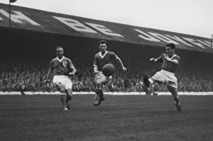 Stanley Matthews competes with John Bramwell and Bobby Collins for the ball in 1958 Stanley Matthews competes with John Bramwell and Bobby Collins for the ball in 1958