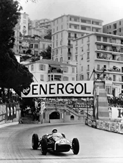 Stirling Moss on the way to winning the 1960 Monaco Grand Prix in his Lotus Climax + Stirling Moss on the way to winning the 1960 Monaco Grand Prix in his Lotus Climax +