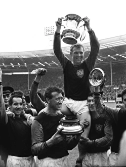 West Ham captain Bobby Moore lifts the FA Cup trophy in 1964 West Ham captain Bobby Moore lifts the FA Cup trophy in 1964