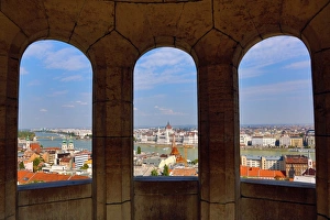 City skyline seen through a window of the Fisherman's Bastion in Budapest, Hungary City skyline seen through a window of the Fisherman's Bastion in Budapest, Hungary