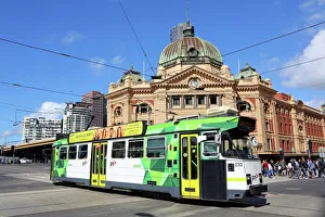 City tram passing Flinders Street Station, Melbourne, Victoria, Australia City tram passing Flinders Street Station, Melbourne, Victoria, Australia