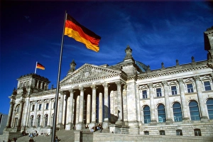 The Reichstag building and German flag, Berlin, Germany The Reichstag building and German flag, Berlin, Germany