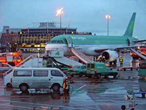 Modern Aircraft Collection: Airbus A320 Aer Lingus at Dubin Airport with evacuation slides deployed and fire service