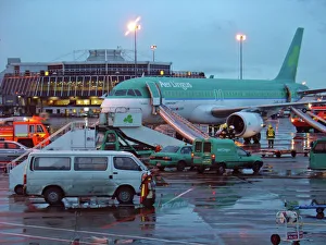 Airbus A320 Aer Lingus at Dubin Airport with evacuation slides deployed and fire service Airbus A320 Aer Lingus at Dubin Airport with evacuation slides deployed and fire service