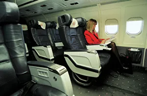 Female passenger in business class on MDC MD83 AOM airliner Female passenger in business class on MDC MD83 AOM airliner