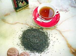 Cup Of Tea Prints: Cup of black tea with chocolate biscuits