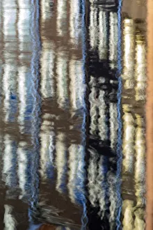 Abstract details of buildings reflected in a typical canal of the river Amstel Amsterdam Abstract details of buildings reflected in a typical canal of the river Amstel Amsterdam