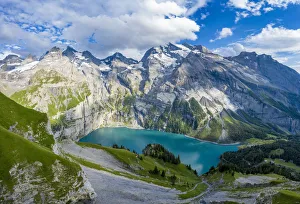 Aerial panoramic of Oeschinensee lake surrounded by woods in summer, Bernese Oberland Aerial panoramic of Oeschinensee lake surrounded by woods in summer, Bernese Oberland