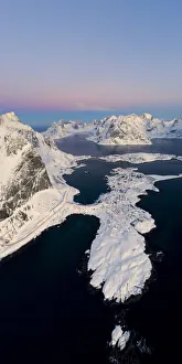 Aerial panoramic of Reine covered with snow at sunrise, Nordland, Lofoten Islands, Norway Aerial panoramic of Reine covered with snow at sunrise, Nordland, Lofoten Islands, Norway